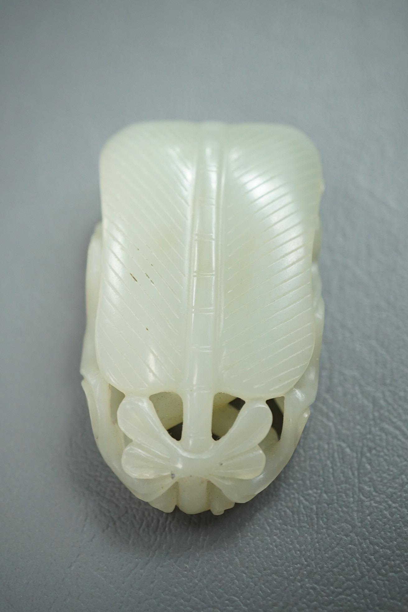 A Chinese pale celadon jade carving of Sun Wukong, the Monkey King, 18th/19th century